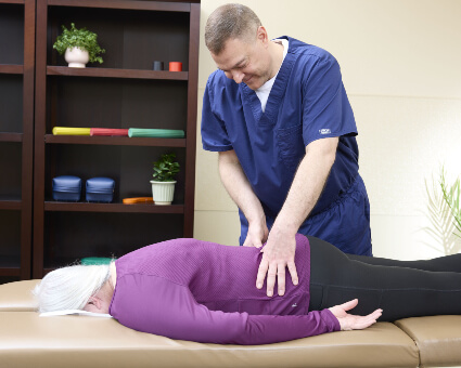 Sheboygan Chiropractor Dr. Tim adjusting patient's back