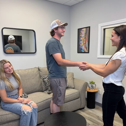 our chiropractor shaking patients hand