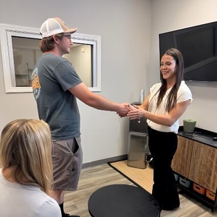 Anderson chiropractor Dr Sarah shaking patients hand
