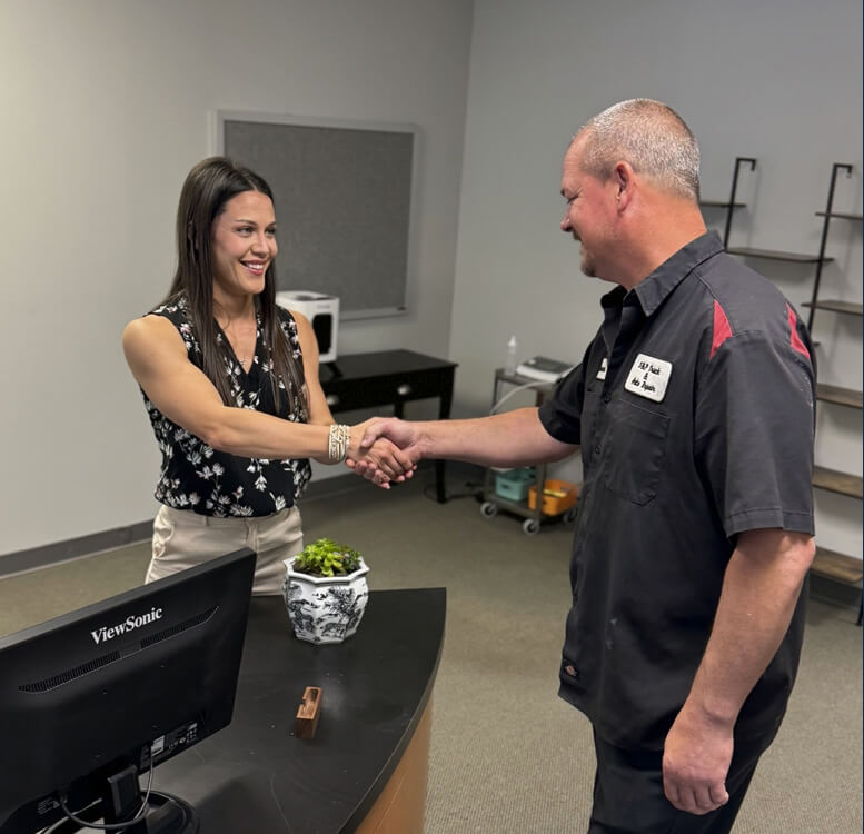 ChirAlign Health & Wellness patient shaking Dr Sarah's hand