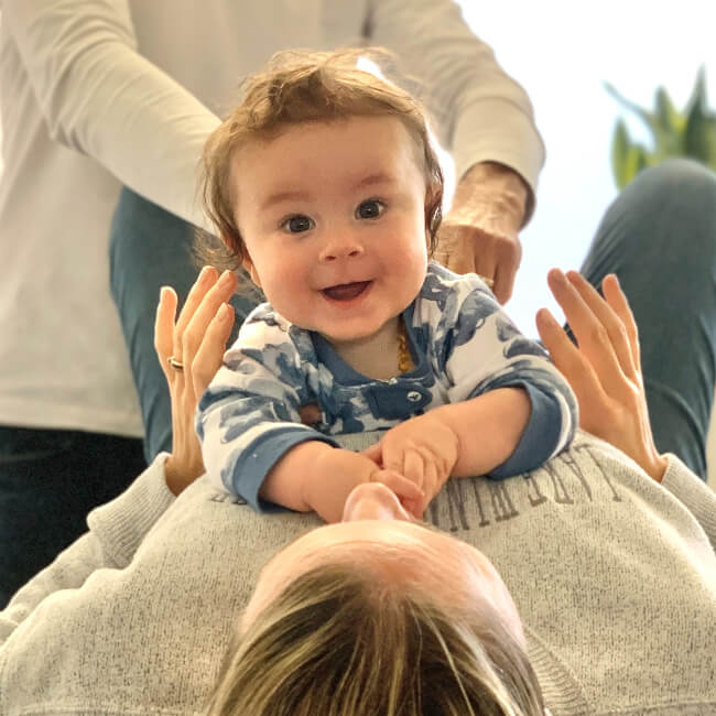 Hand on child's back