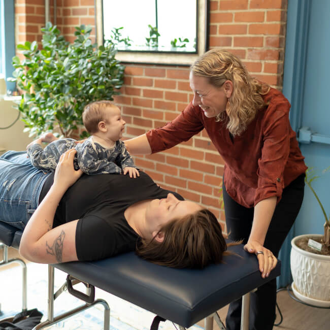 Adjusting baby on mom
