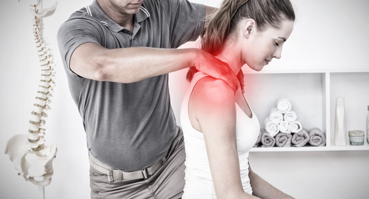 Female patient receiving a chiropractic shoulder adjustment