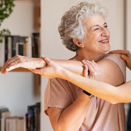 Female patient getting her arm stretched