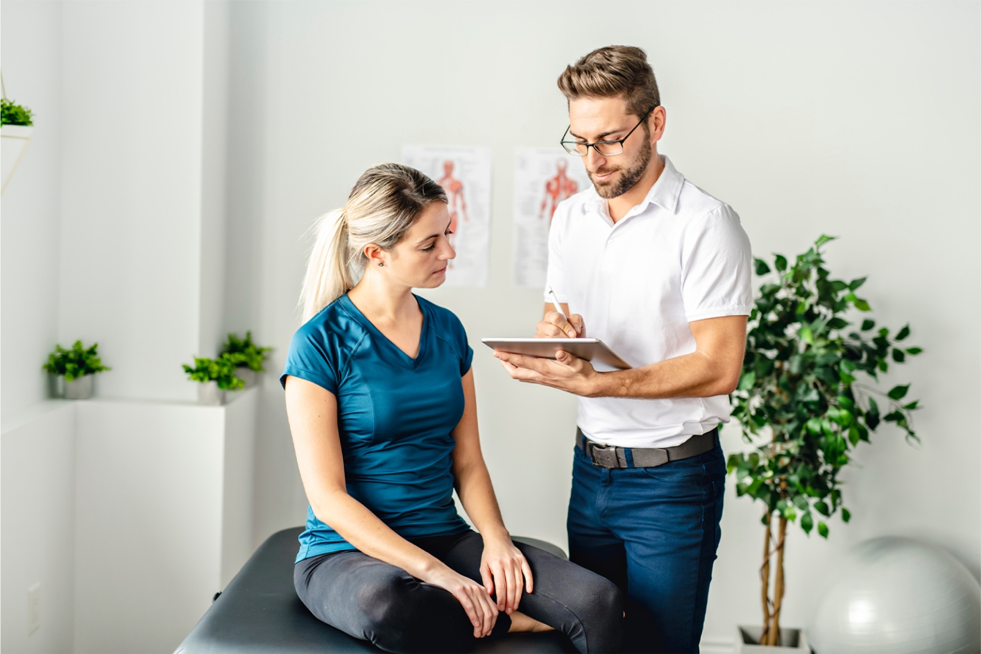 Chiropractor in consultation with patient