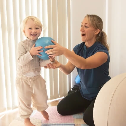 Ali playing with child