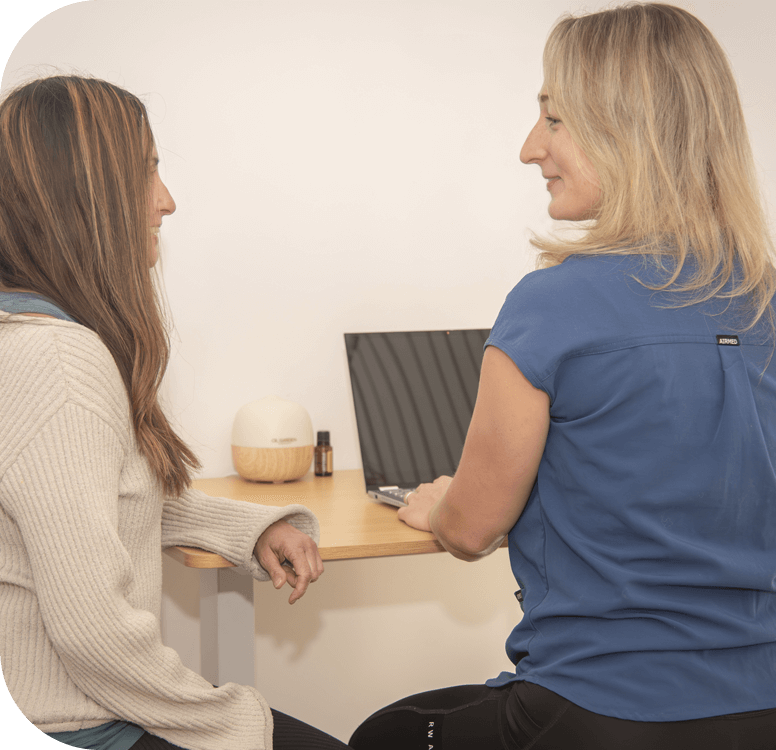 Healing with Alena practitioner talking with client
