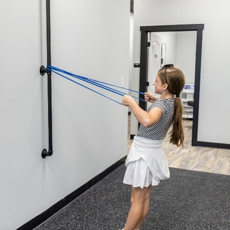 girl doing stetches with bands