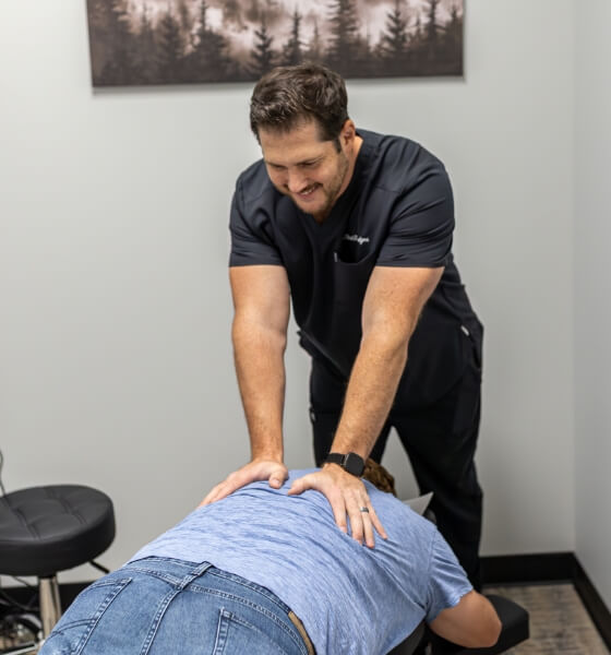 Lancaster chiropractor Dr Chad adjusting patients back