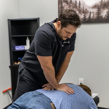Peak Performance Sport & Spine patient having back adjusted
