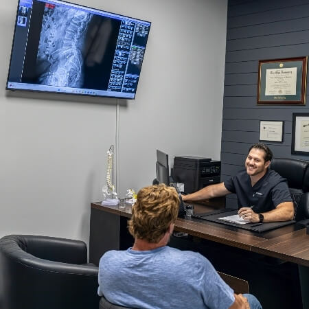 Lancaster chiropractor Dr Chad showing patient xrays