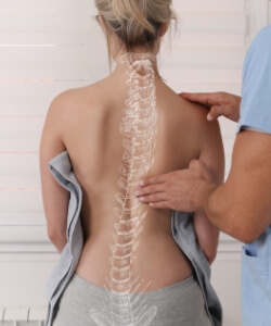 Spine overlay on female patient's back