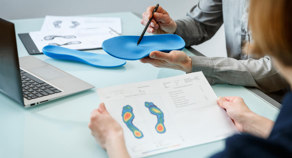 Doctor and patient discussing orthotics