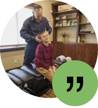 Young boy receiving a neck adjustment