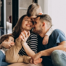 Smiling family of four
