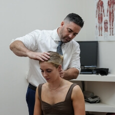Female patient receiving a gentle neck adjustment