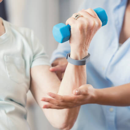 Female patient receiving physical therapy