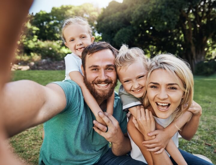 Family of four posing for a selfie