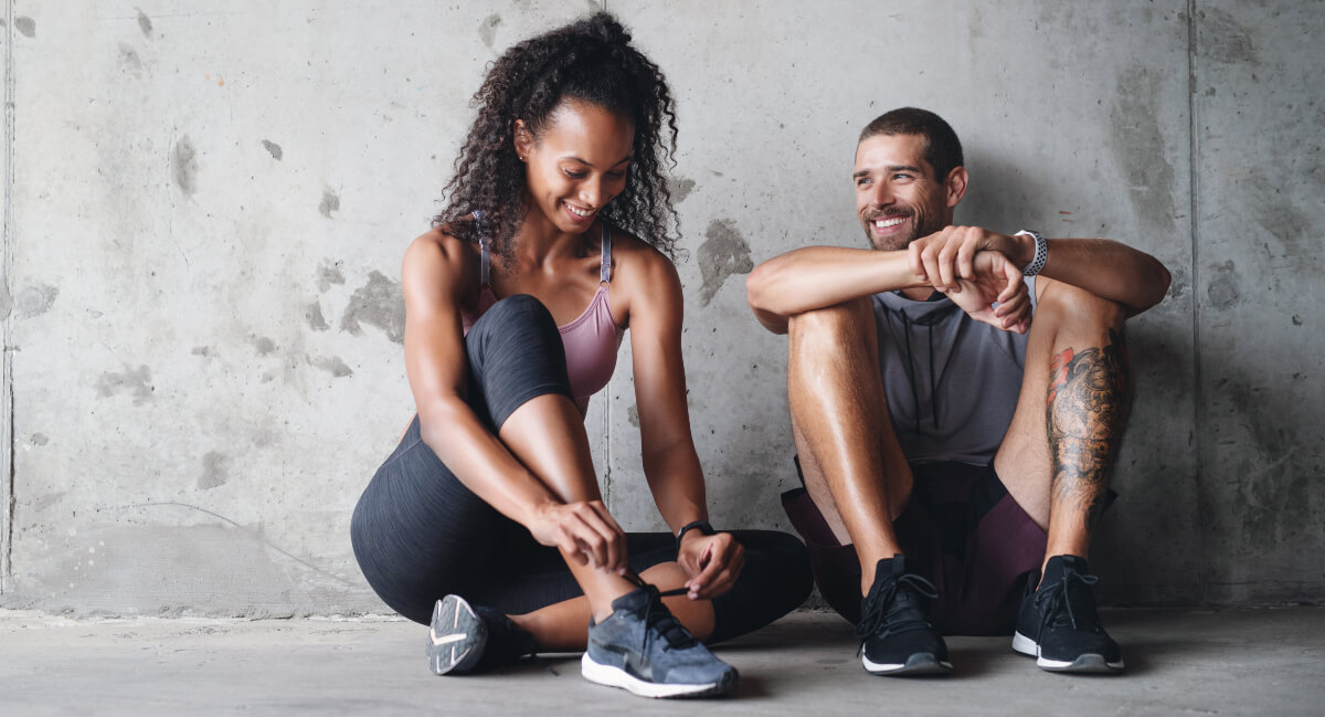 Man and woman getting ready for training