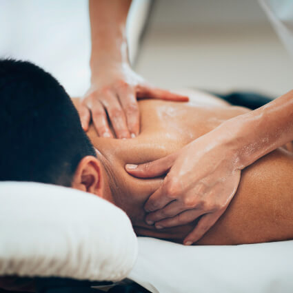 Male patient receiving a shoulder massage