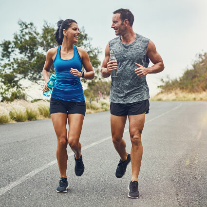 Male and female athletes running