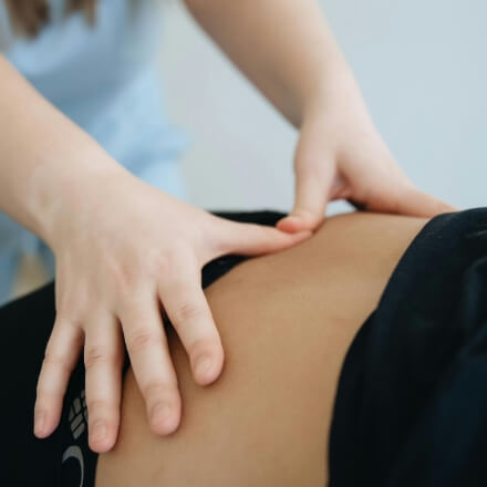 Patient receiving a lower-back adjustment