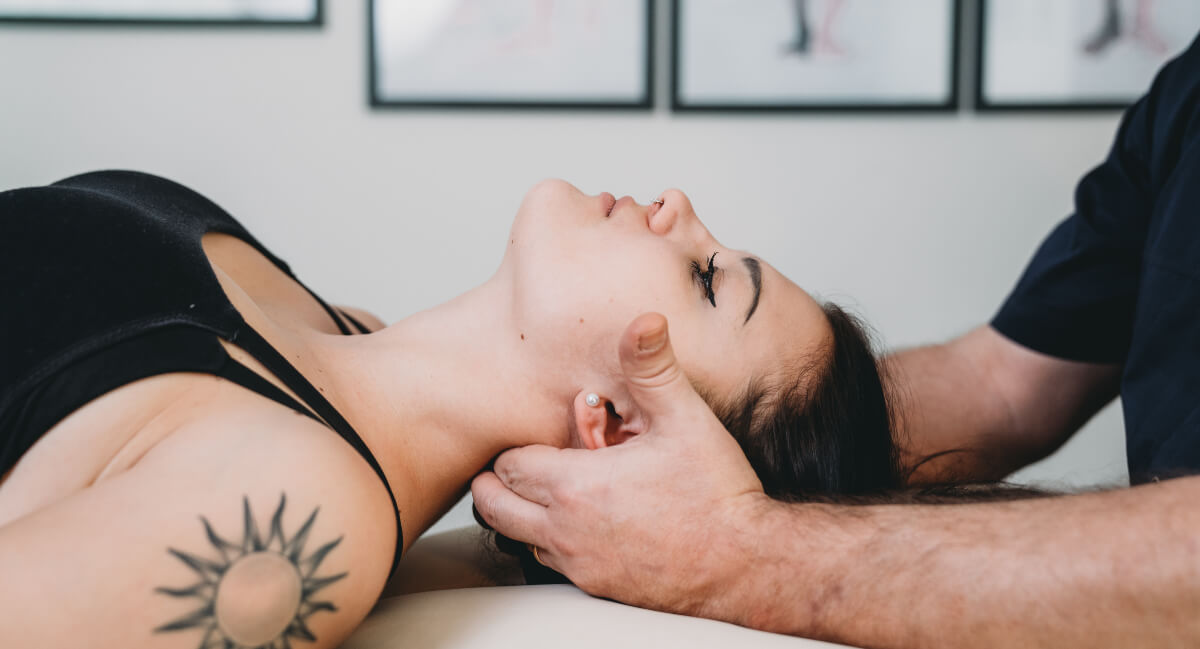 Female patient receiving a gentle neck adjustment