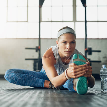 Woman stretching her leg