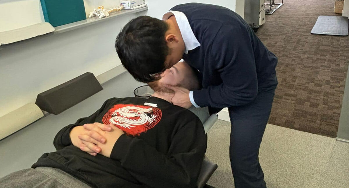 Chiropractor adjusting patient's neck