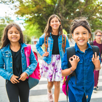Group of young girls walking to school