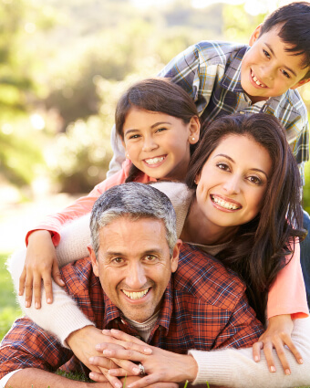 Smiling family on top of each other