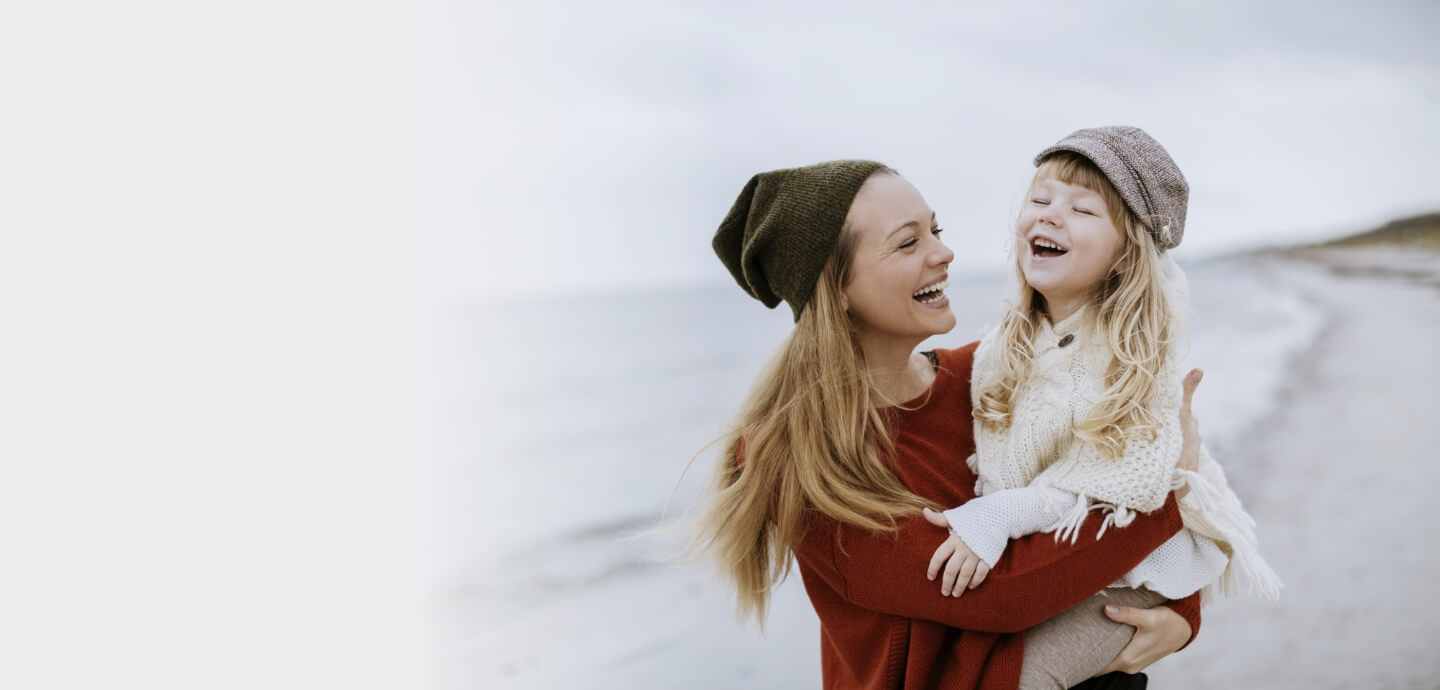 mother and daughter smiling