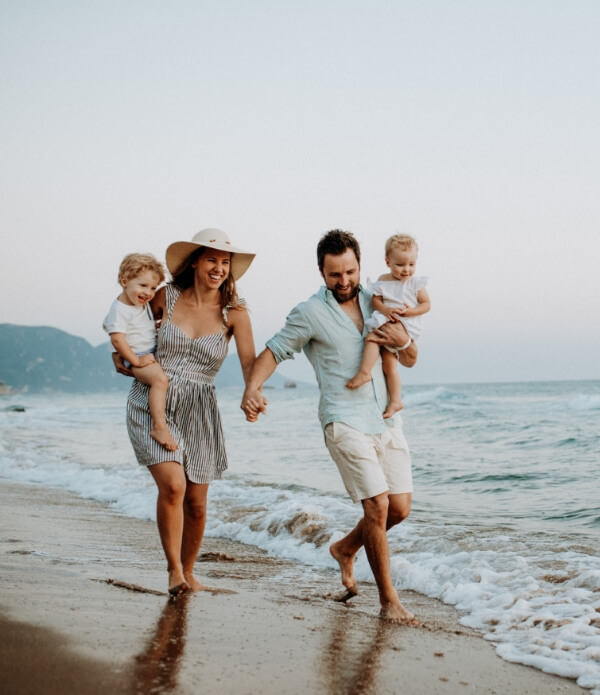 family walking on the beach