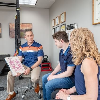 Dr Glenn talking with patients