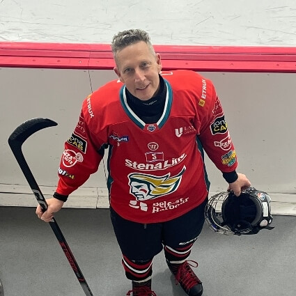 Dr Glenn playing hockey