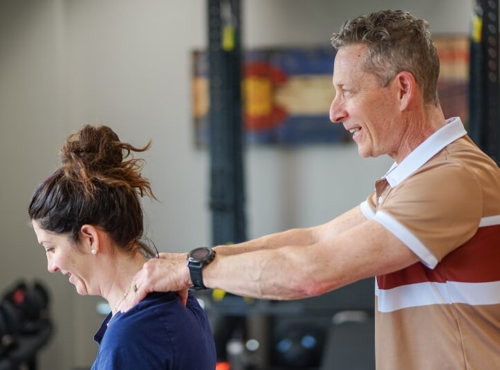 Denver chiropractor Dr. Glenn adjusting patients neck