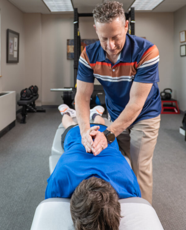 Dr. Glenn adjusting patient
