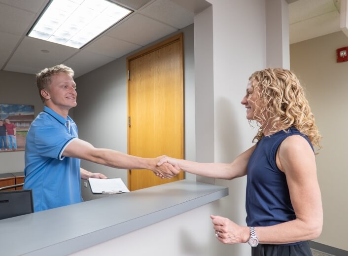Denver Chiropractic Center staff shaking patients hand