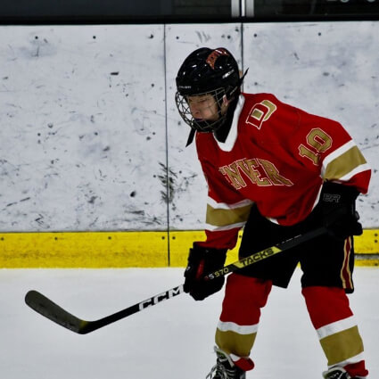 child playing hockey
