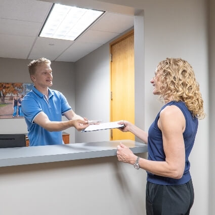 patient checking in at front desk