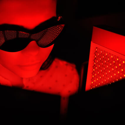 Female patient being treated with Red Light Therapy in Everett WA