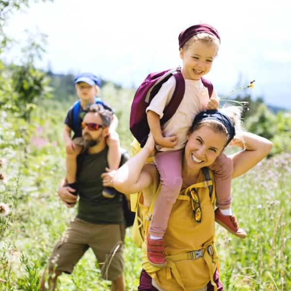 Family of four hiking outdoors