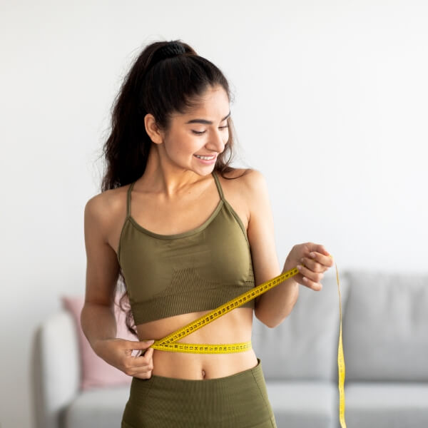 Woman measuring waist