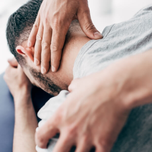person having neck adjusted