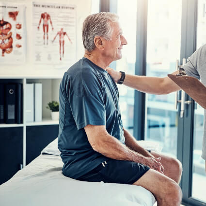 Male patient in chiropractic consultation
