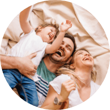 family of three laughing