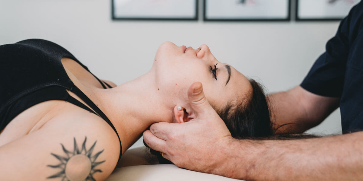 Woman getting neck adjustment