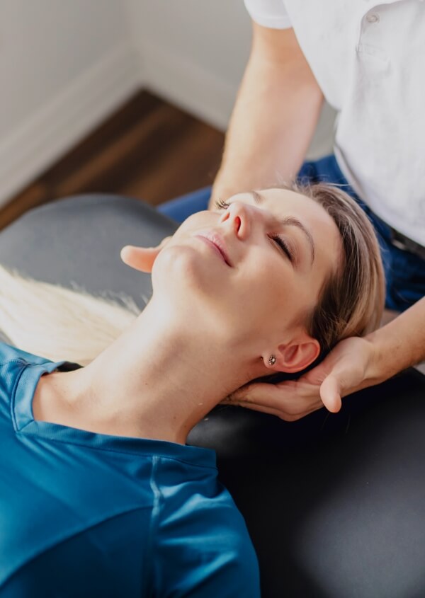 woman getting neck adjusted