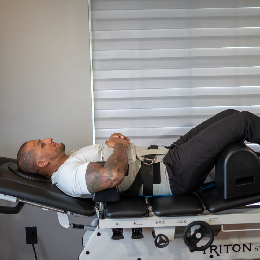 man on spinal decompression table