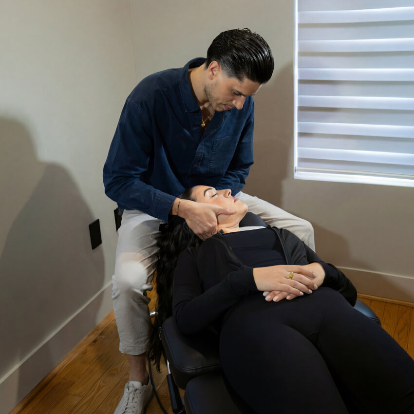 adjusting woman's neck